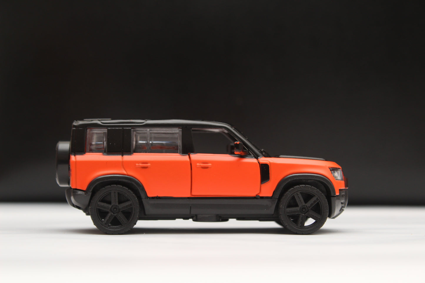 1:43 Defender Orange/Black Metal Body -  Kunju Vandi  