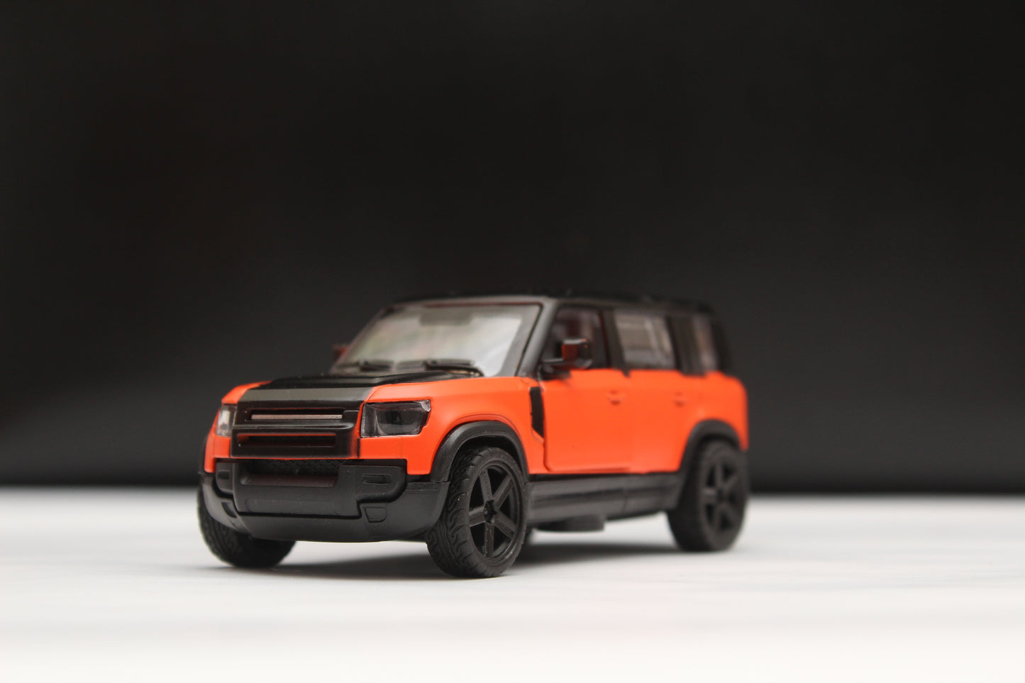 1:43 Defender Orange/Black Metal Body -  Kunju Vandi  