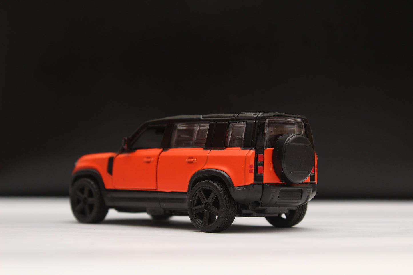 1:43 Defender Orange/Black Metal Body -  Kunju Vandi  